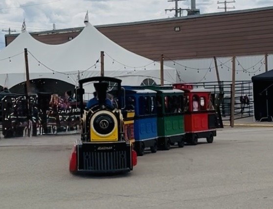 The Northern Lights Express train coming head-on at an outdoor event